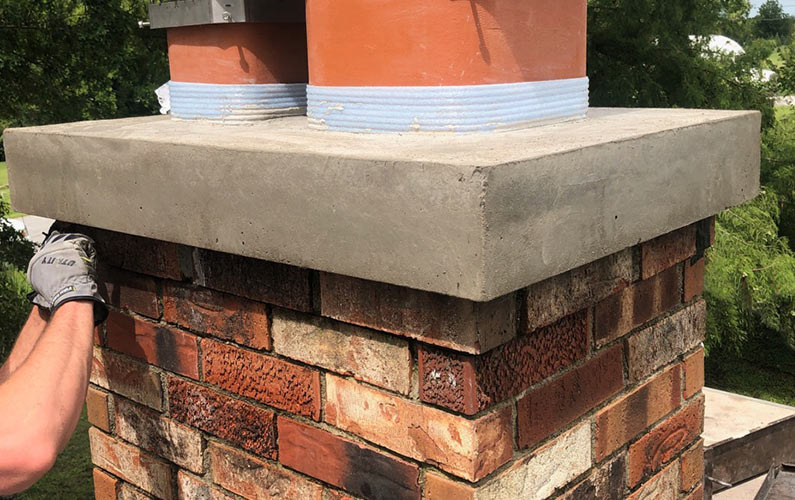 Brick chimney with new crown installation